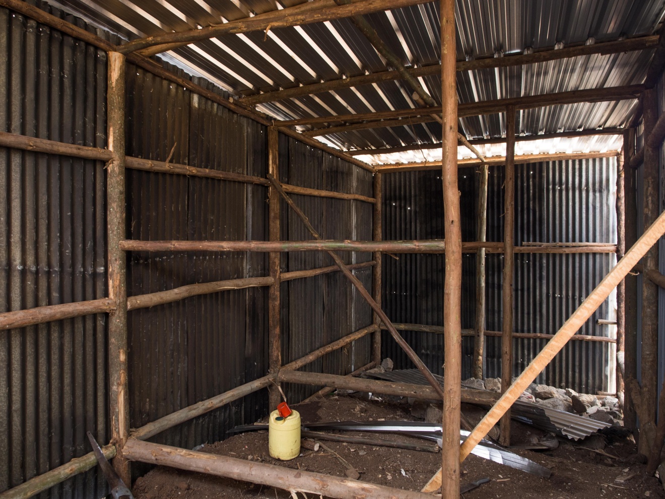 The interior of a shack under construction. Here, GI sheets are used for the walls